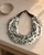 Grey and Cream Layered Necklace — necklaces, vibey rim light linen surface lifestyle photo
