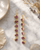 Raw Pink Tourmaline Dangle Earrings — earrings, editorial marble lifestyle photo
