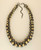 Cultural Elements gold and gunmetal-tone layered statement necklace with chunky beads and adjustable chain.