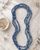 Blue Tones Endless Fabric-Wrapped Beaded Necklace — necklaces, editorial marble lifestyle photo