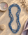 Blue Tones Endless Fabric-Wrapped Beaded Necklace — necklaces, vibey closeup lifestyle photo