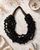 Twisted Multi-Strand Black-Brown Necklace — necklaces, editorial marble lifestyle photo
