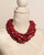 Cultural Elements twisted multi-strand red wood disc necklace with horn closure, 21 inches.