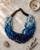 Twisted Multi-Strand Blue Necklace — necklaces, editorial marble lifestyle photo