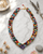 Multicolor Hand-Wrapped Textile & Gemstone Beaded Necklace — necklaces, editorial marble lifestyle photo