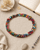 Recycled Textile & Gemstone Beaded Collar Necklace — necklaces, flatlay linen lifestyle photo