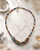 Multicolor Textile & Gemstone Cluster Necklace — necklaces, editorial marble lifestyle photo