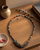 Multicolor Textile & Gemstone Cluster Necklace — necklaces, sunlit shelf lifestyle photo