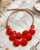 Crimson Radiance Tagua Necklace – Ecuador — necklaces, editorial marble lifestyle photo