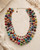 Colorful beaded necklace on a light background