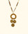 Handwoven necklace with cascading natural medallions