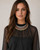 Tri-Tone Brass Collar Necklace worn by a model over a black sheer blouse, silver, copper, and brass bands sitting at the throat