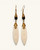 Hand-coiled brass and carved bone drop earrings with black bead, front view on white background showing both pieces