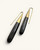 Kanai Kenyan horn and brass threader earrings at a diagonal angle highlighting polished horn texture and brass cone cap detail