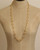 Sculpted Open Links Multi Style Necklace in gold worn as a continuous long loop on dress form, displaying the full open-ring link chain