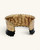 Hand-hammered brass cuff bracelet with black band, interior view showing unfinished brass inner surface and beaded trim detail