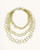 Brass hand-linked three-strand circular ring chain necklace on white background with toggle clasp at top, product front view