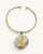 Brass collar choker necklace with round Ankole horn disc pendant and vertical brass bar accent, front view on white background