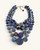 Blue kantha sari bead necklace with four strands, overhead flat-lay showing graduated bead sizes and gold wire links