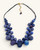 Kantha recycled sari textile bead layered necklace in indigo blue on white background, front view showing full length