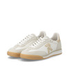Rieker W4000-81 Retro-inspired ladies trainer in off-white with gold accents and contrasting sole. Casual everyday fashion trainer.
