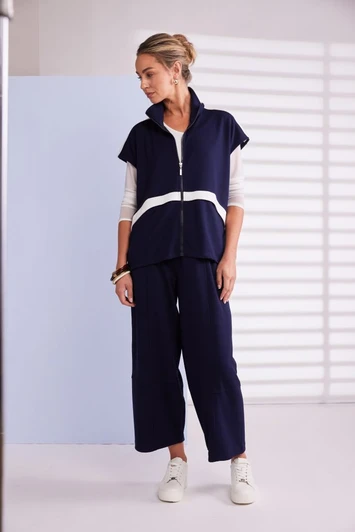 NAYA NPA26195 High neck zip top with contrast color panel and pocket detail