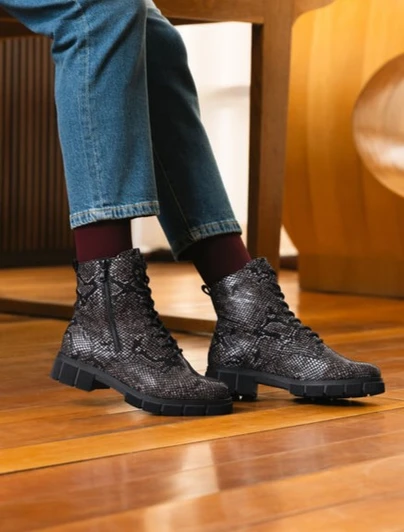 Remonte D2S72-03 Mid-height lace-up winter boot in black/brown python-effect finish with warm lining and chunky sole.