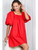 Woman posing in a scarlet red puff sleeved mini dress with rounded neckline