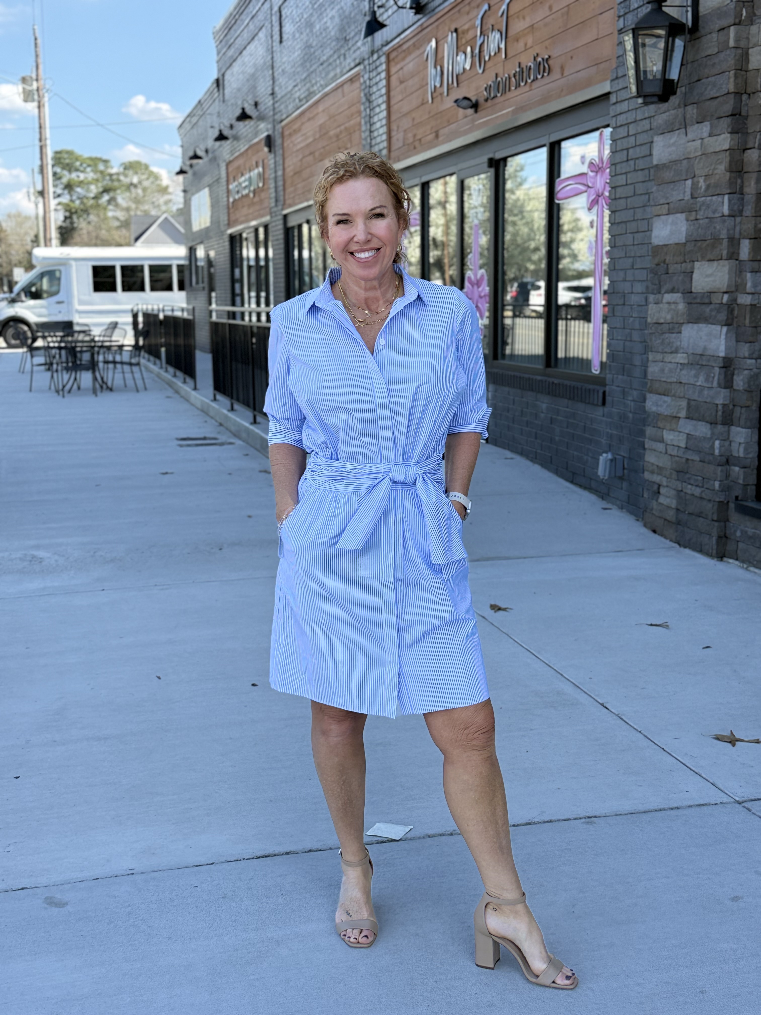 Woman's long short-sleeve orange and white stripped dress with bow