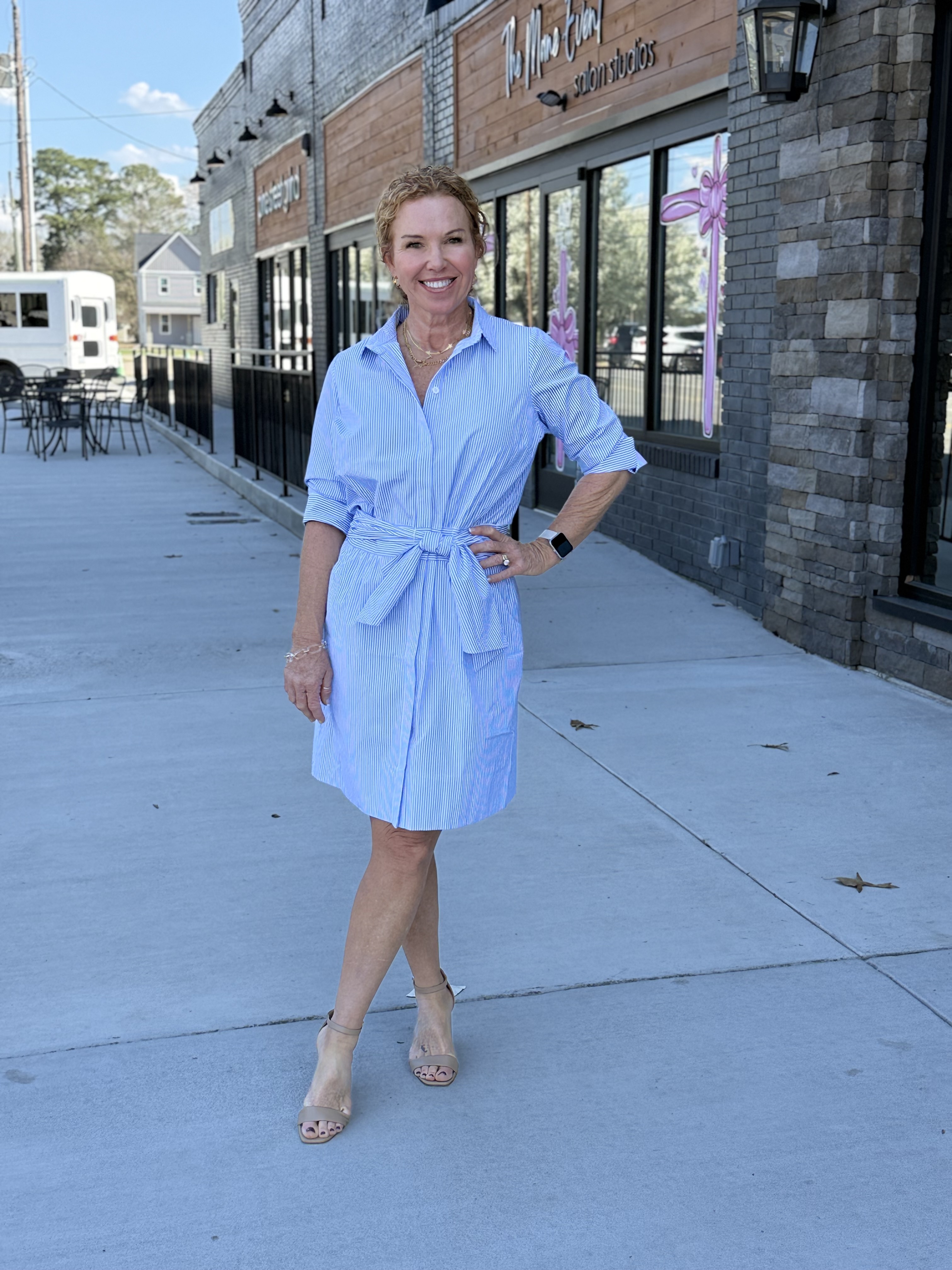 Woman's blue-grey quarterzip sweatshirt with pink illustrative floral design