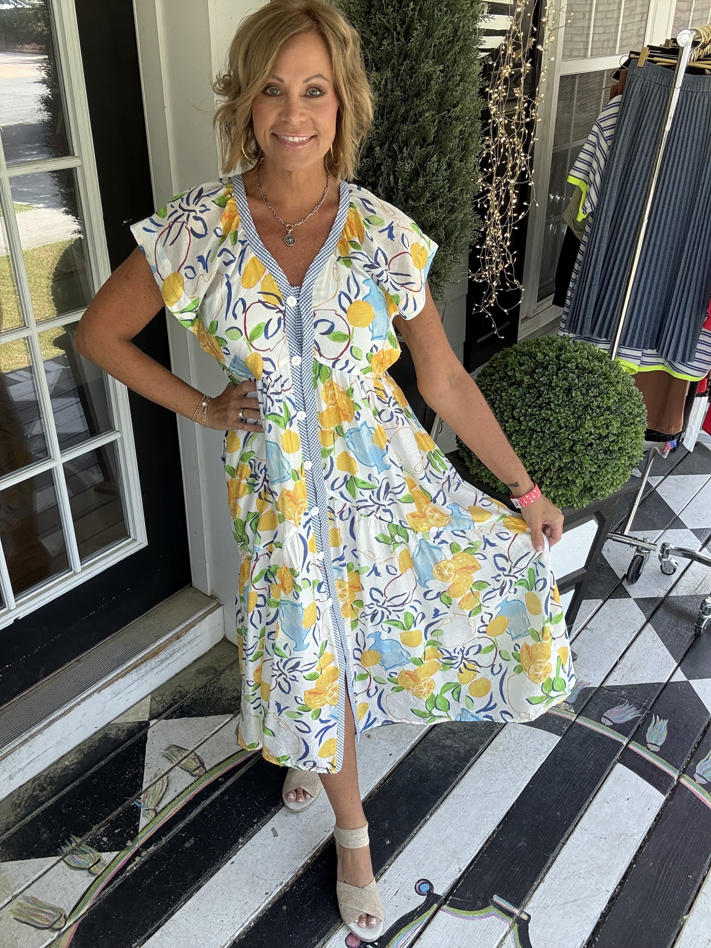 Woman's long short-sleeve orange and white stripped dress with bow