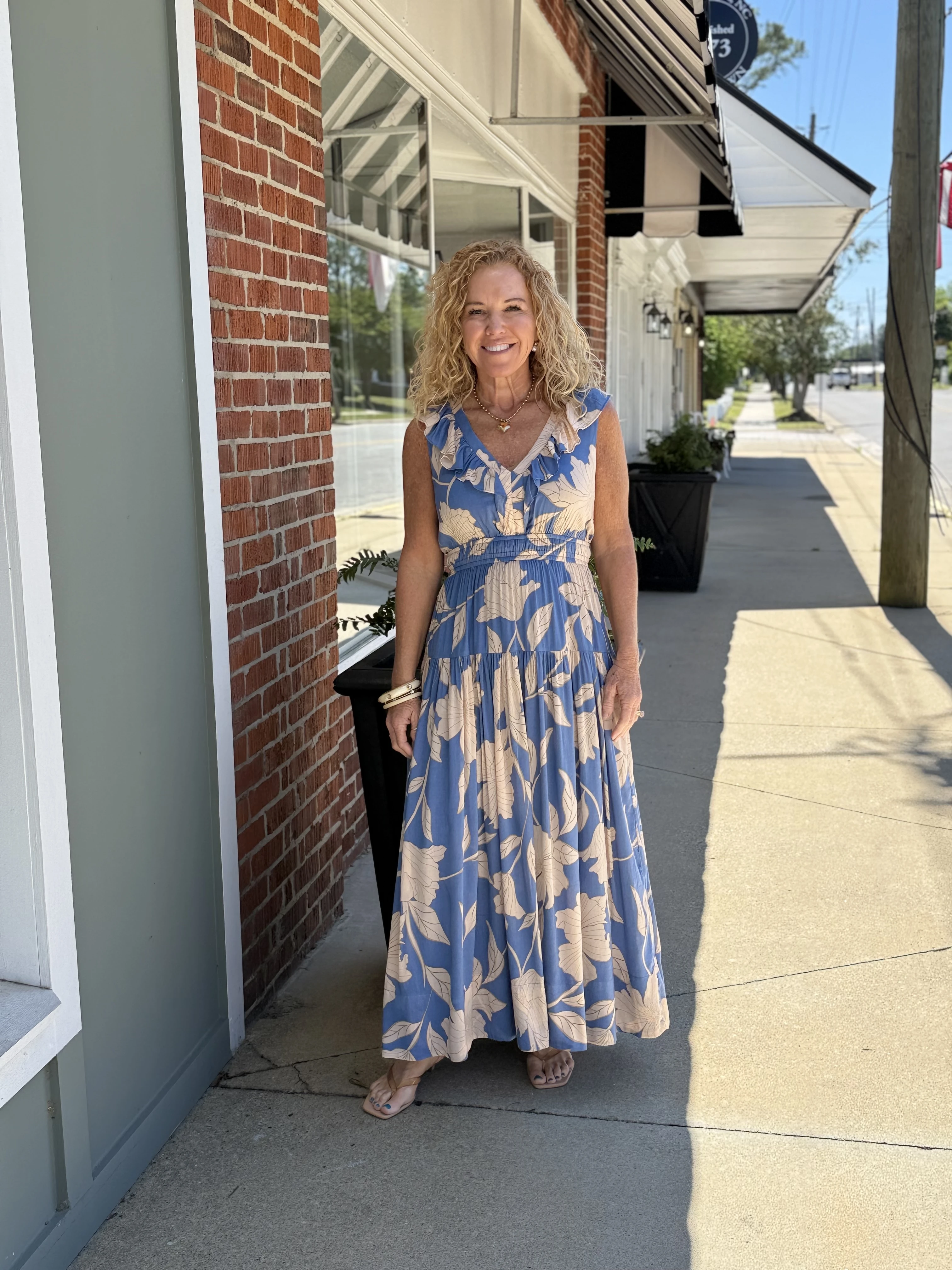Woman's long short-sleeve orange and white stripped dress with bow
