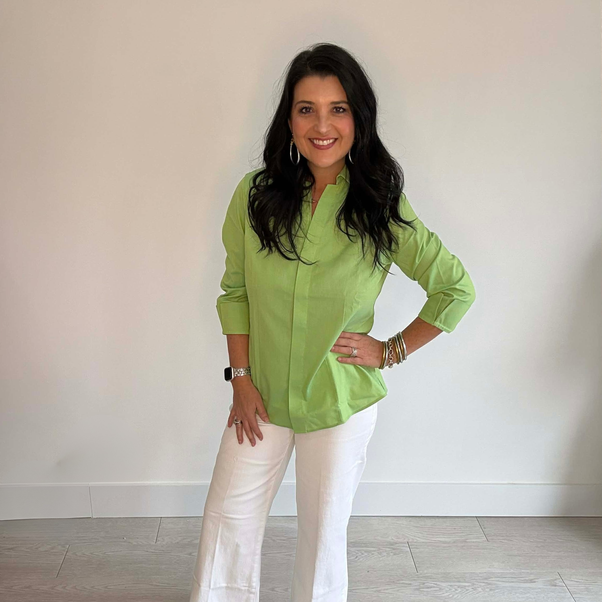 Woman's bright green button down blouse