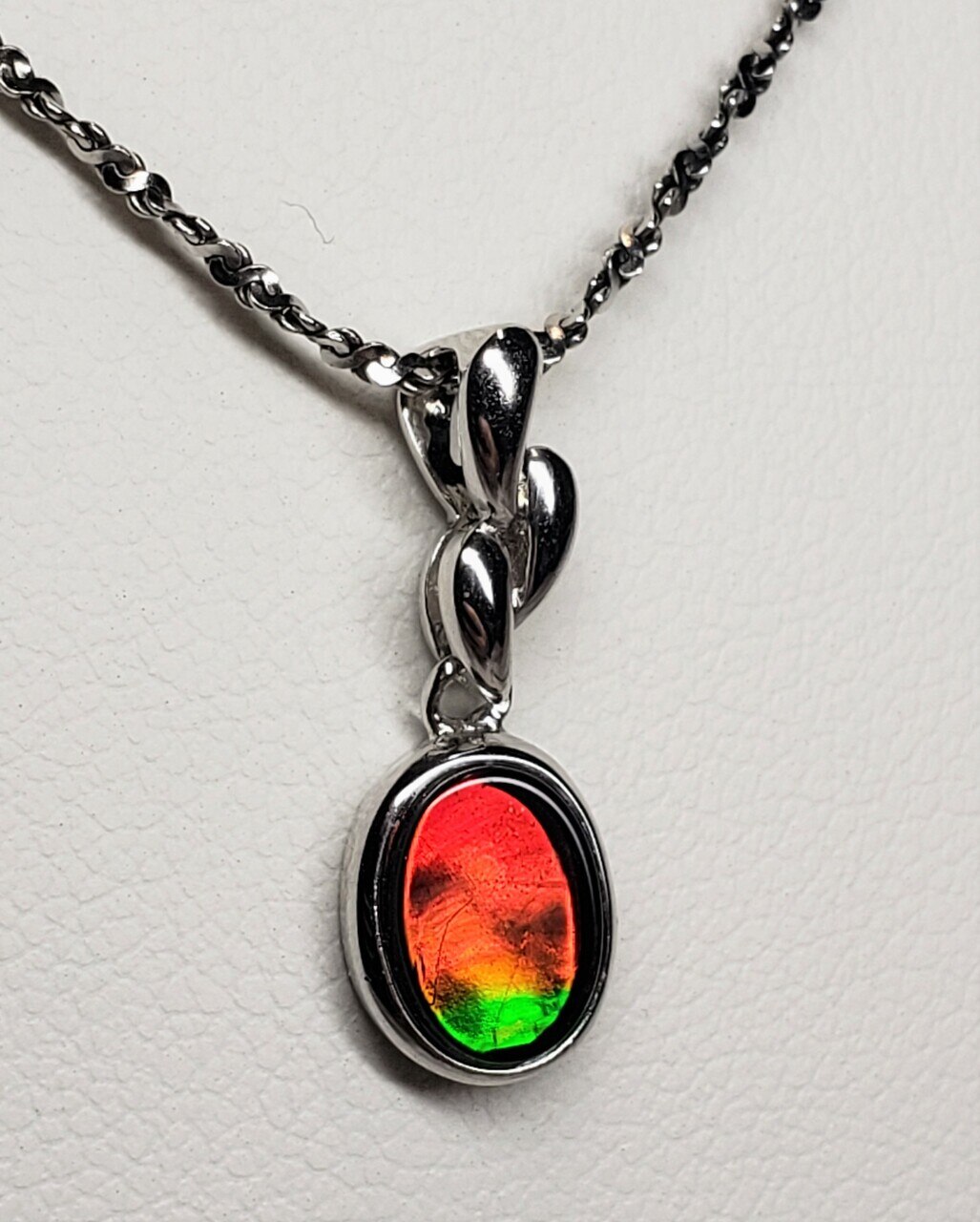 Classic Oval Ammolite Sterling Silver Pendant featuring a 7 X 9 mm Triplet Gem