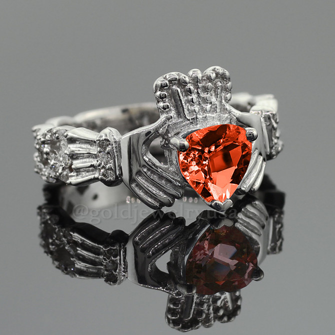 White Gold Diamond Claddagh Ring Garnet center stone.