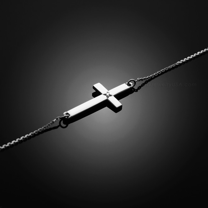 white gold sideways cross bracelet with a diamond