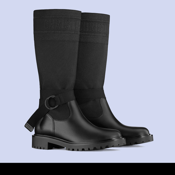 Cover photo of a Dior D-Major Boot. Crafted from black technical fabric. Featuring a bicolor 'Christian Dior' signature at the top, a 'CD’ signature adjustable nylon belt and crimped rubber sole