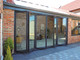 Opening Visofold Aluminium Bi-Folding Doors Outdoors
