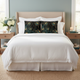 Peacock pillows on bed