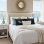 Coastal bedroom with rectangular lumbar wing pillow square