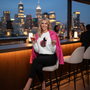 White sweatshirt rooftop bar with pink leather jacket