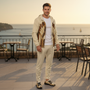 Man in Open Botanical Windbreaker at Coastal Café