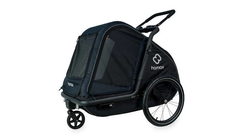 Profile shot of a large black Hamax dog bike trailer.
