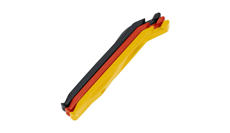 Three plastic tyre levers in black, red and yellow 