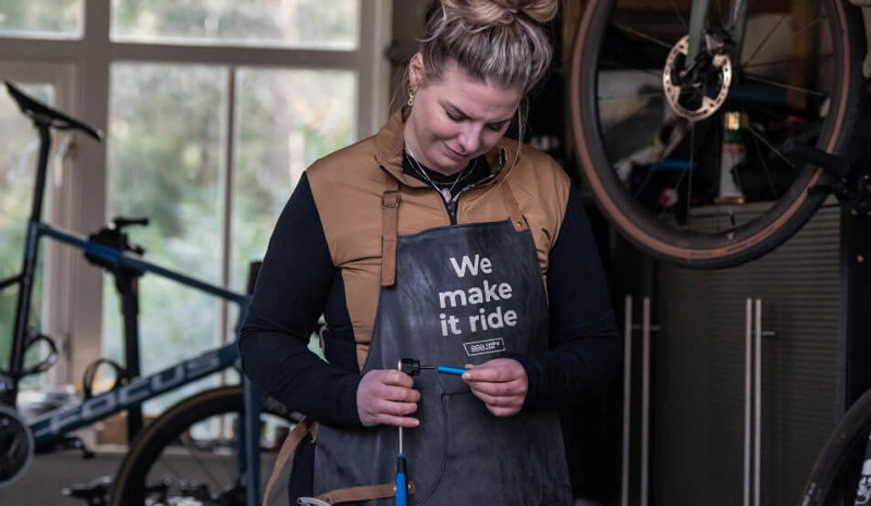Well-organised bike maintenance workspace with tools laid out