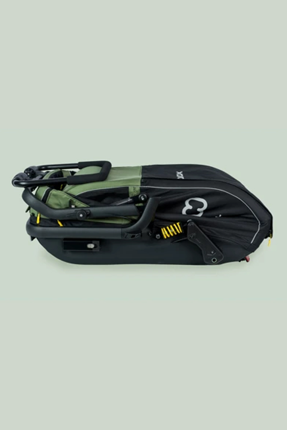 Hamax Pluto M dog trailer folding mechanism shown mid-fold demonstrating compact storage capability