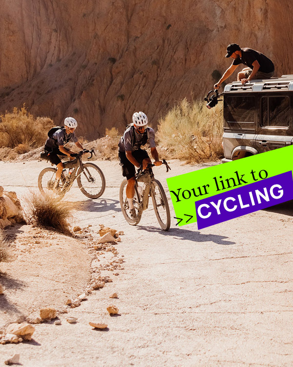 Cyclists riding rugged terrain