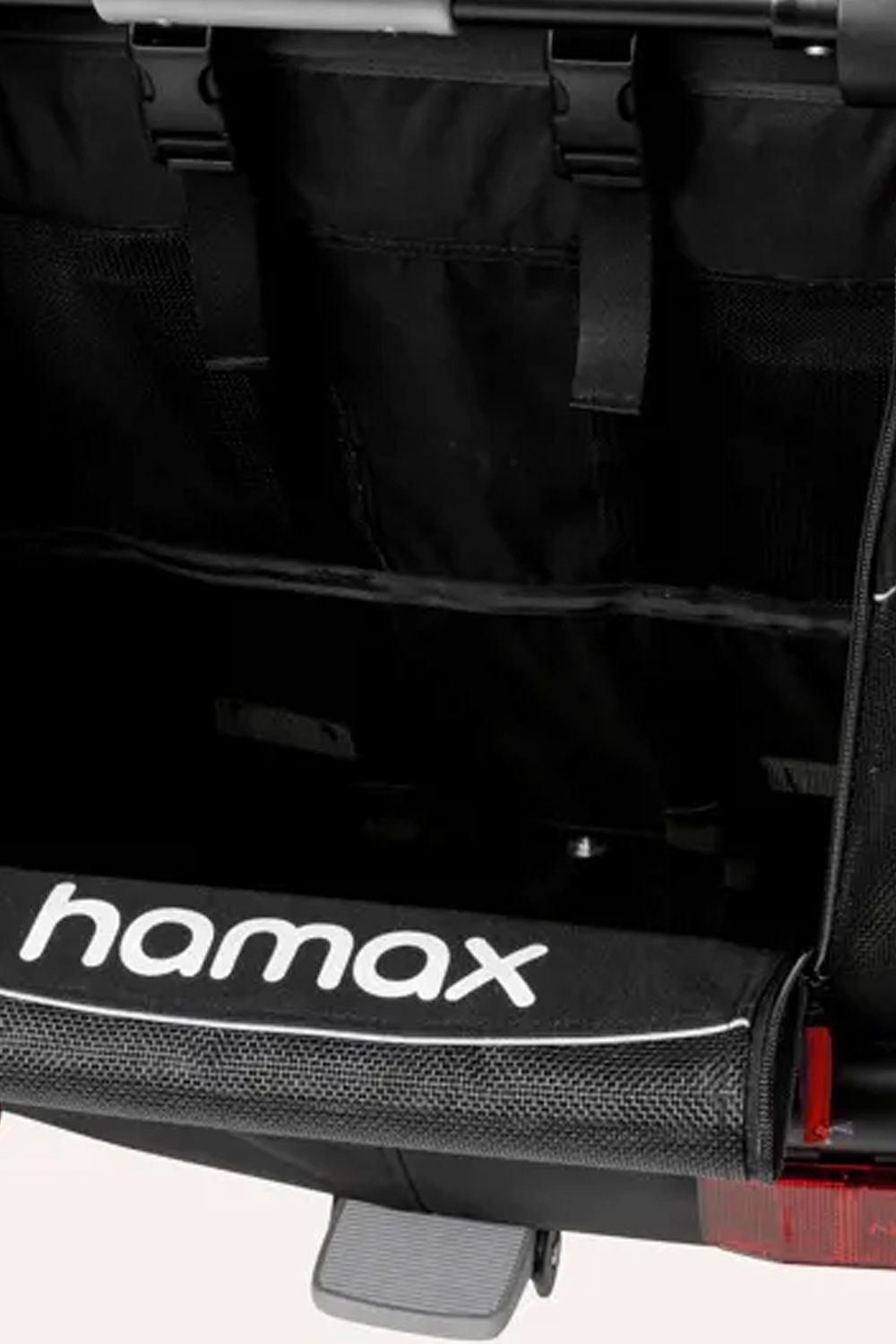 Hamax Outback 2-seat rear storage compartment open showing ample cargo space for family outings