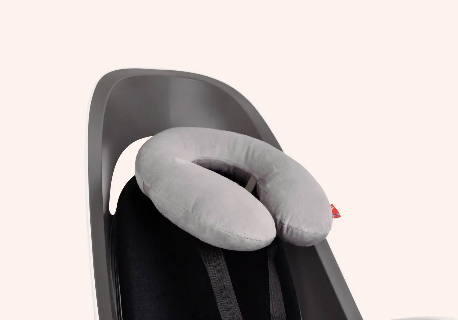 Hamax Amiga frame-mounted bike seat with neck pillow accessory fitted to harness