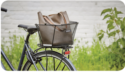 Rear bike basket with a brown bag attached to a commuter bicycle